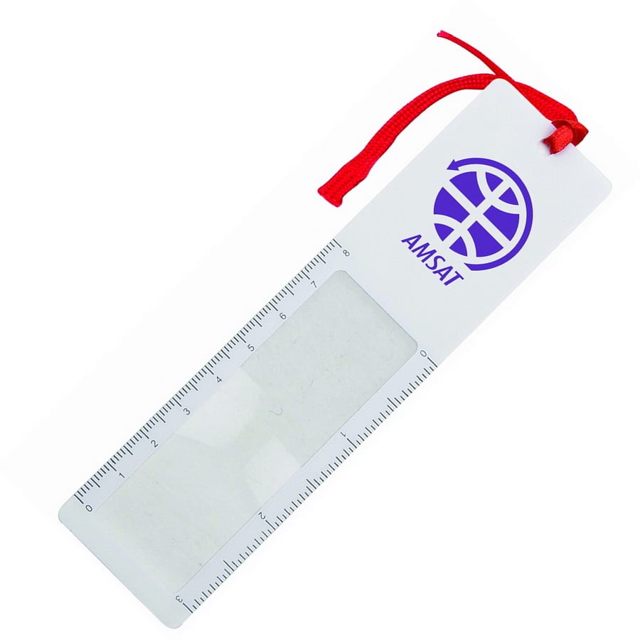 A clear magnifying bookmark ruler with a red ribbon and a logo on the top. Measures up to 15 cm. Magnifying Bookmark Ruler - Image 1