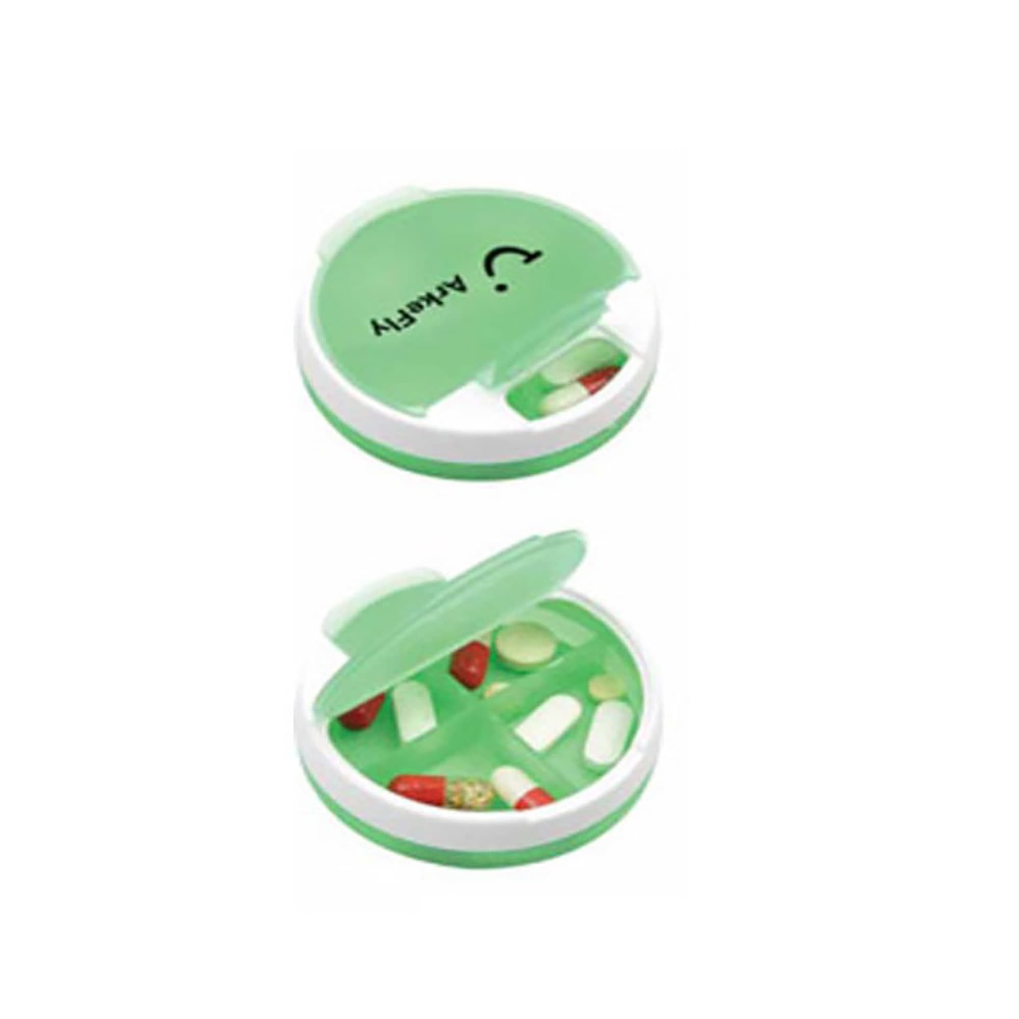 A green and white pill box with multiple compartments containing various capsules and tablets. Pill Box - Image 1