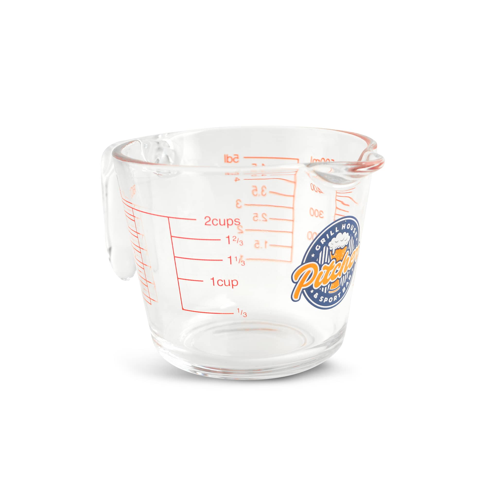 A clear glass measuring jug with red markings and a handle, featuring a logo on the side. Baking Measuring Jug - Image 1