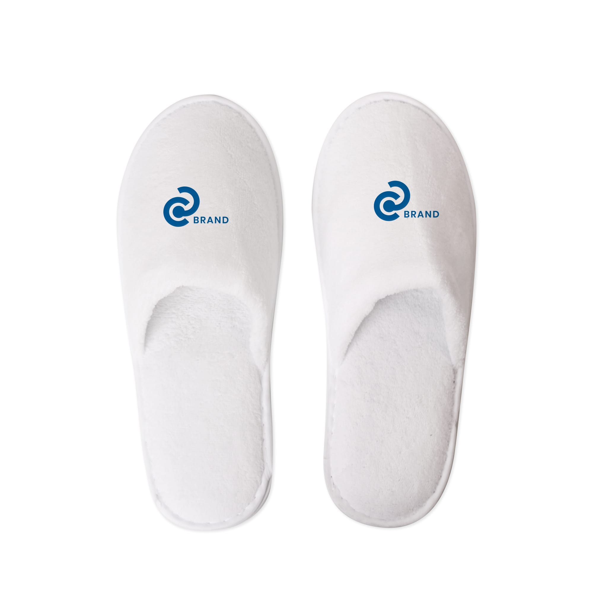 White hotel slippers featuring a logo on each slipper. The slippers have a soft, plush design. Hotel Slippers - Image 1