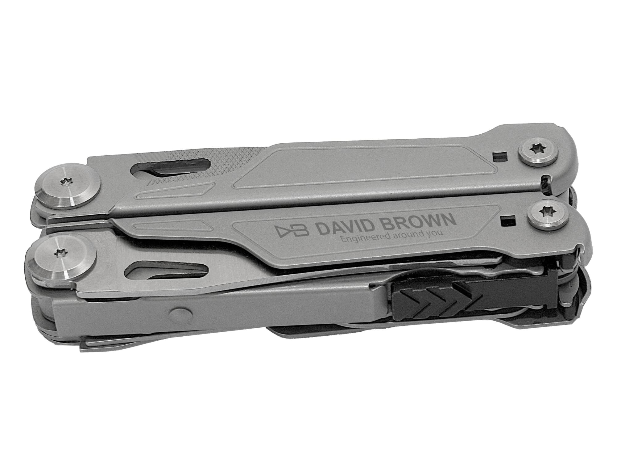 A grey multi-tool with various attachments, featuring a logo on its side. Compact design for easy portability. Tytan Multi Tool - Image 1