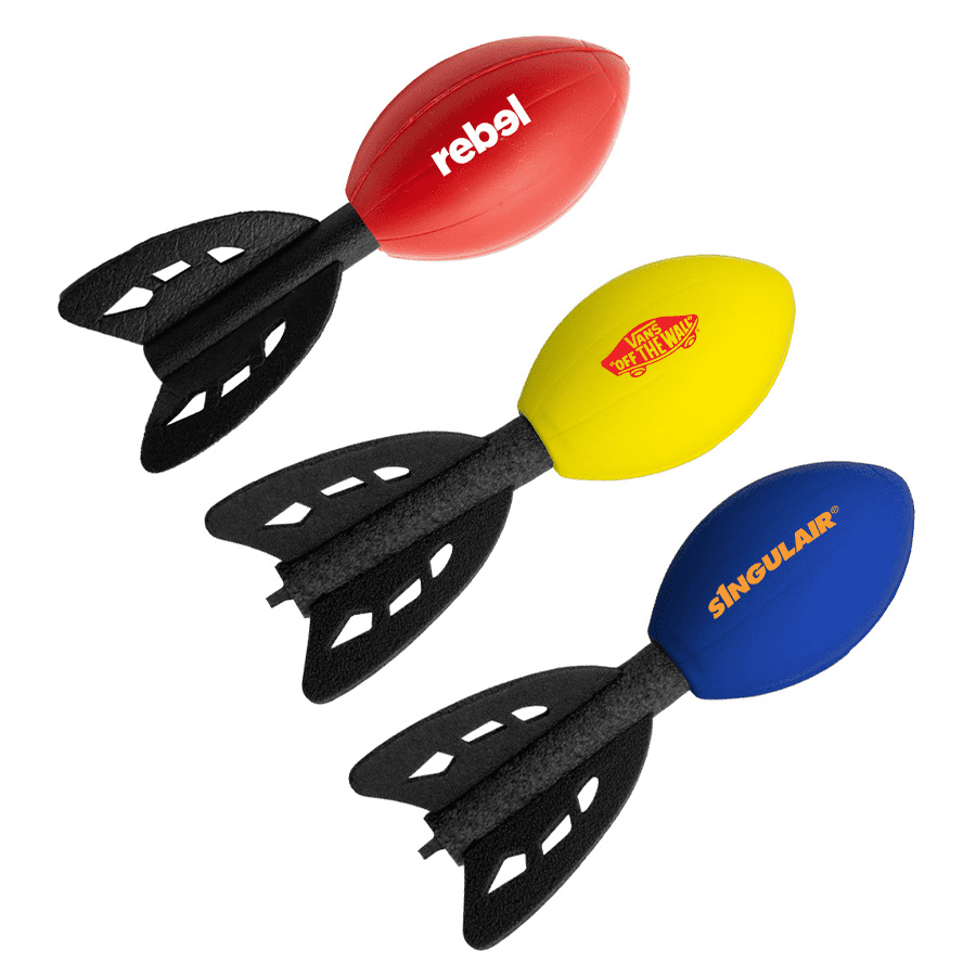 Three football-shaped rocket toys in red, yellow, and blue, each with black fins and featuring logos. Football Rocket - Image 1