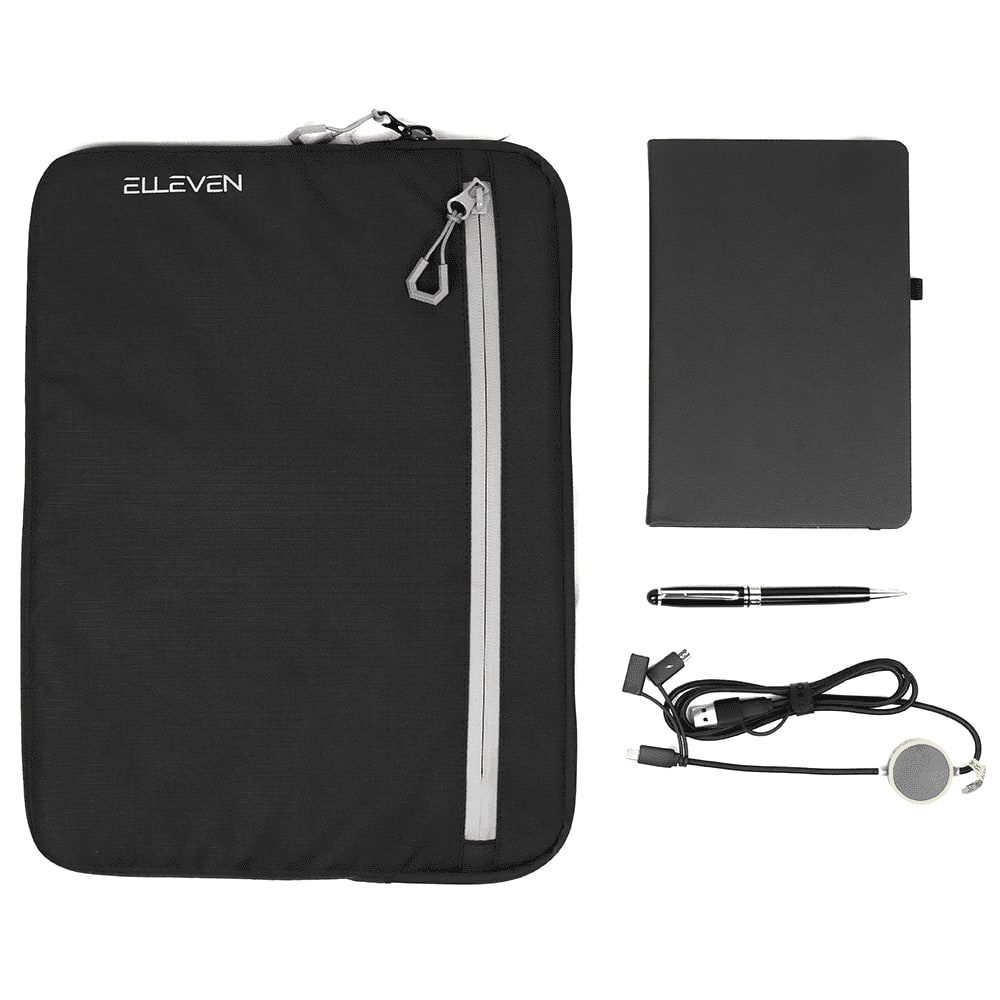 A black zippered pouch, a black notebook, a silver pen, and a charging cable with a circular connector. The pouch has a logo. Work Essentials Pack - Image 1