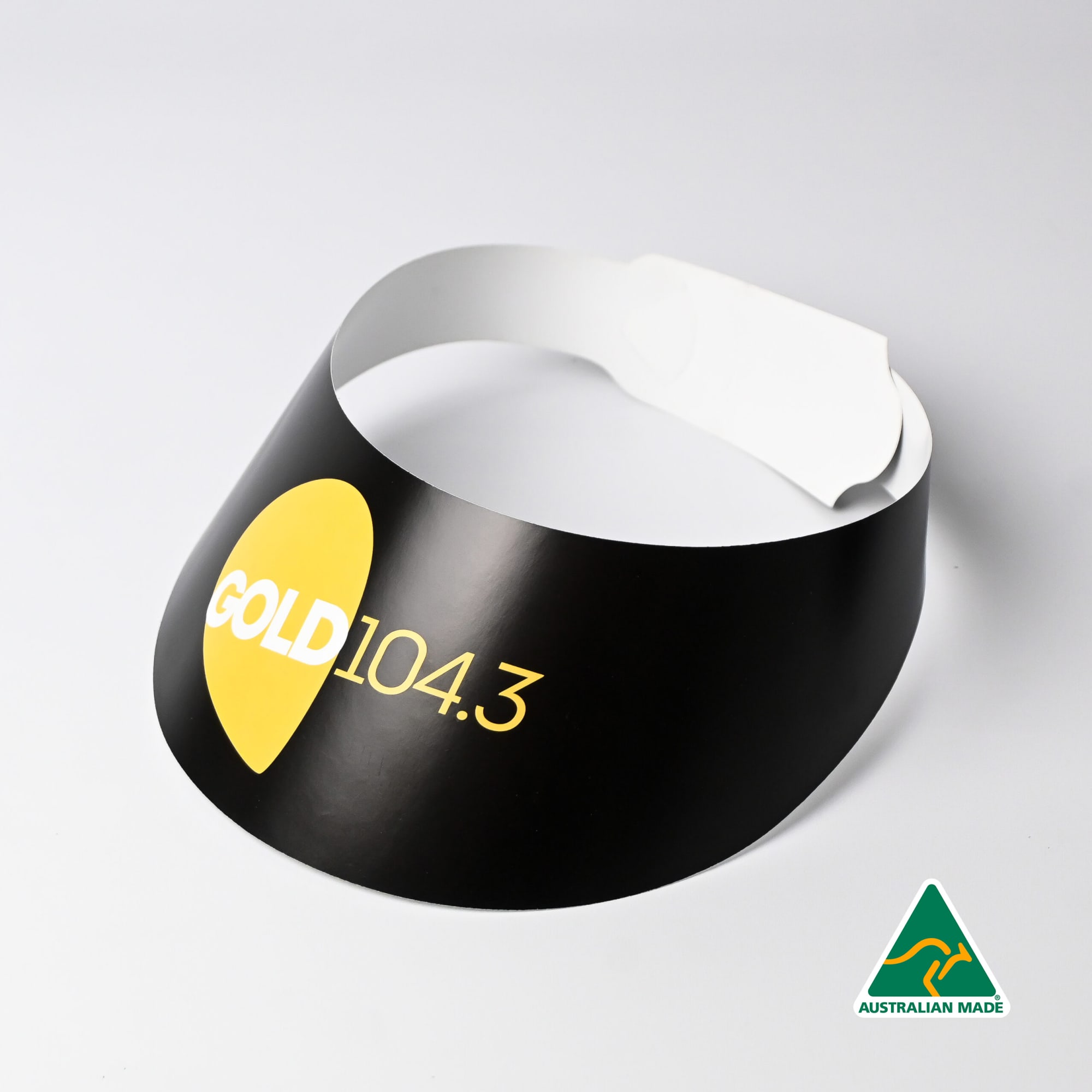 A black sun visor featuring a yellow logo, with a white adjustable strap and an Australian Made label. Sun Visors - Image 1