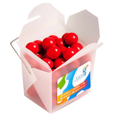 A frosted noodle box containing round orange chocolate drops, with a handle and a colourful logo. Frosted Noodle Box with Orange Choc Drops 100g - Image 1