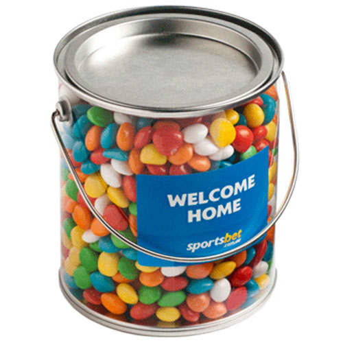 A large PVC bucket filled with colourful chewy fruits in various shades, featuring a handle and a branding label. Big PVC Bucket with Chewy Fruits 850g - Image 1