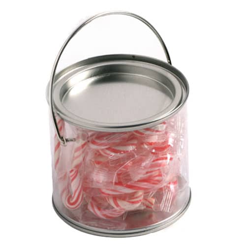 A medium clear PVC bucket filled with red and white striped candy canes, featuring a metal handle. Medium PVC Bucket with Candy Canes x20 - Image 1