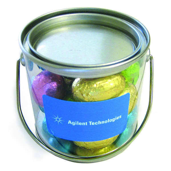 A small bucket containing mini Easter eggs wrapped in vibrant colours, featuring a silver lid and a handle. Small Bucket with Mini Easter Eggs - Image 1