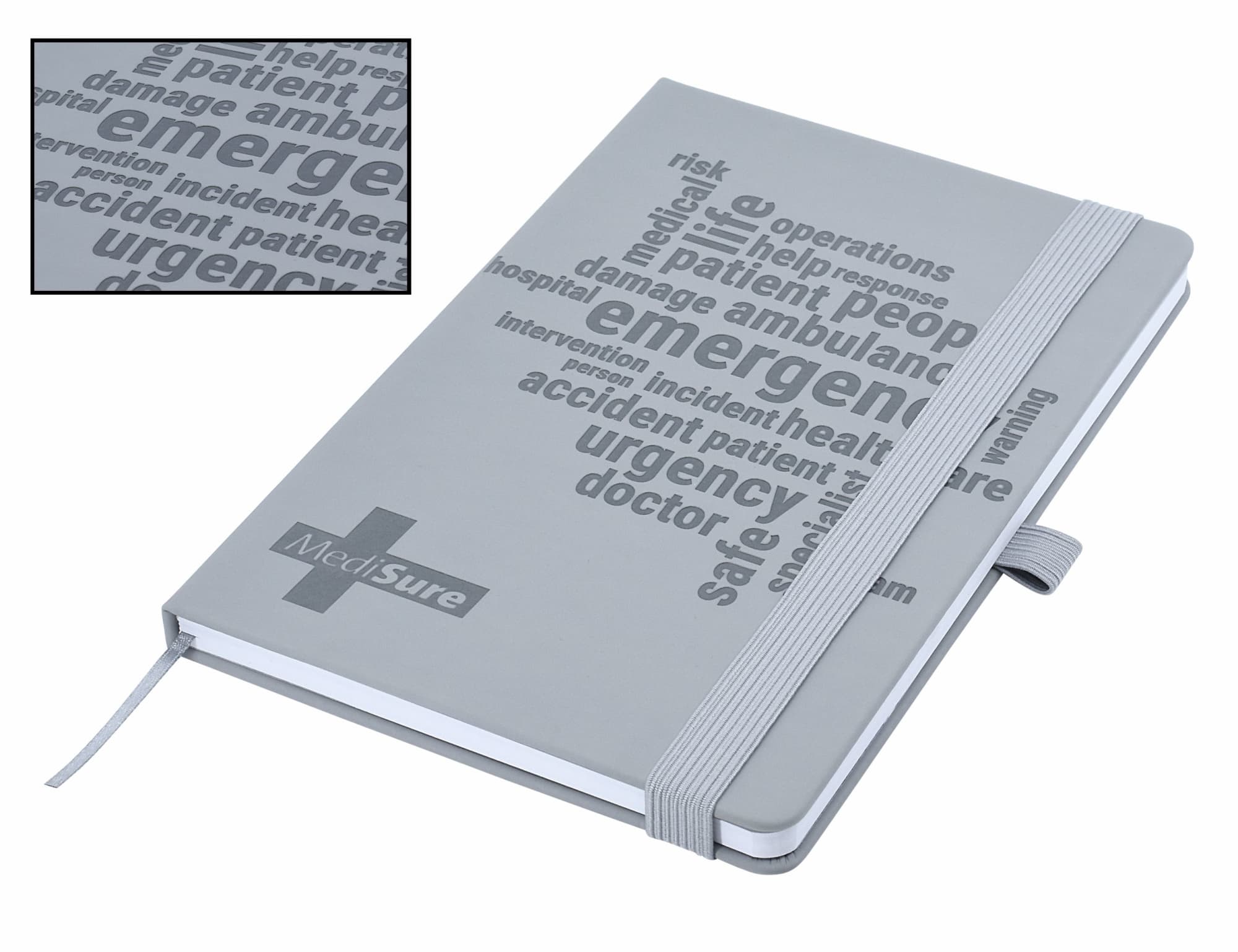 A grey A5 notebook with debossed text and a ribbon bookmark, featuring a logo on the cover. Designa Soft Touch A5 Notebook - Image 1