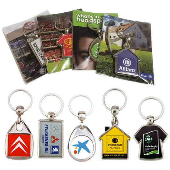 A collection of metal key rings on backing cards, featuring various designs and colours, packaged in poly bags. Metal key ring- on backing card poly bagged-duplex - Image 1