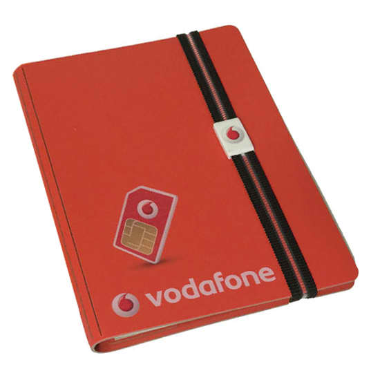 A5 bonded leather notebook in red with an elastic band and clip, featuring a logo on the cover. A5 Bonded leather replaceable book with elastic and clip - Image 1
