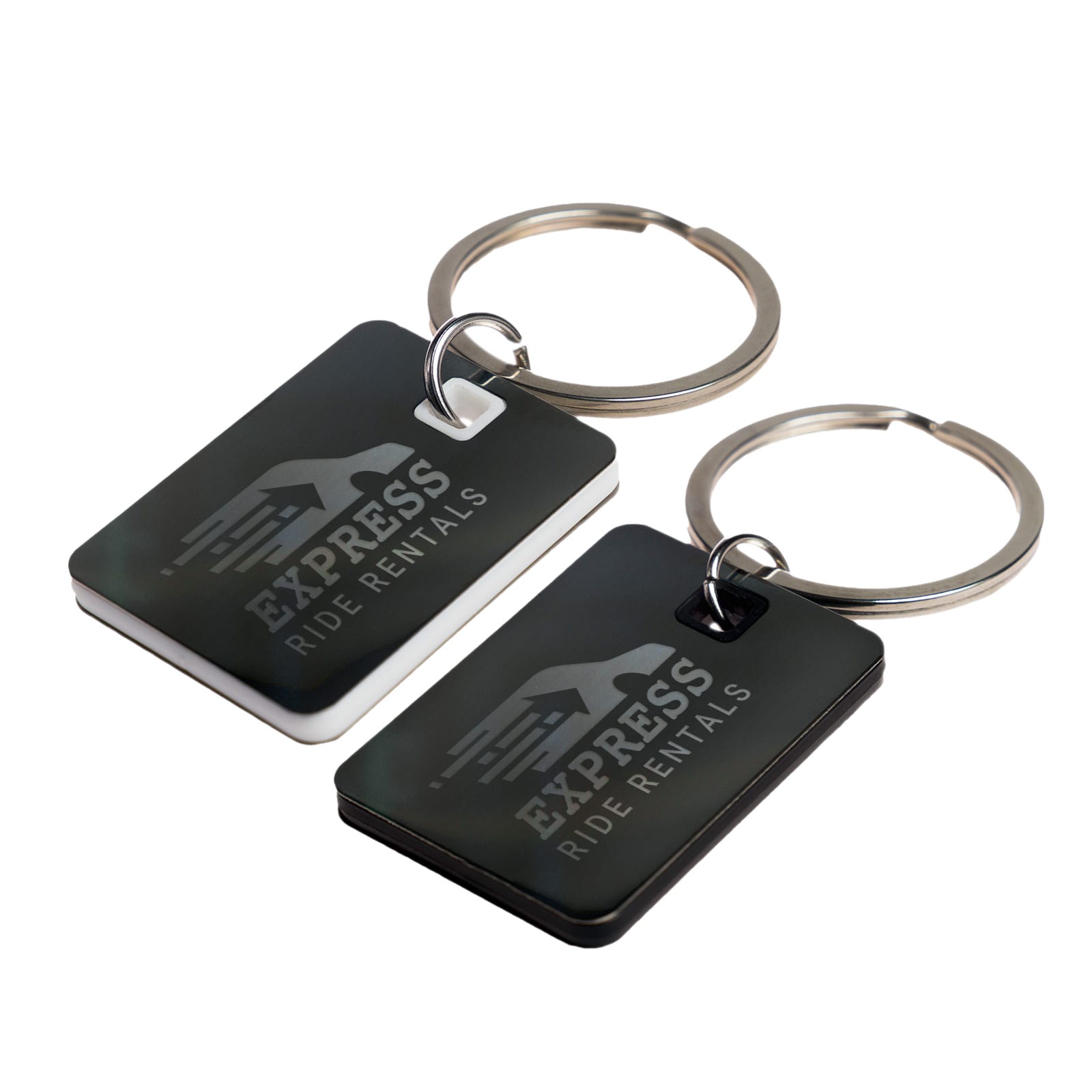 A pair of rectangular stainless steel keytags, one black and one white, both attached to key rings. Rectangle Stainless Steel Keytag - Image 1