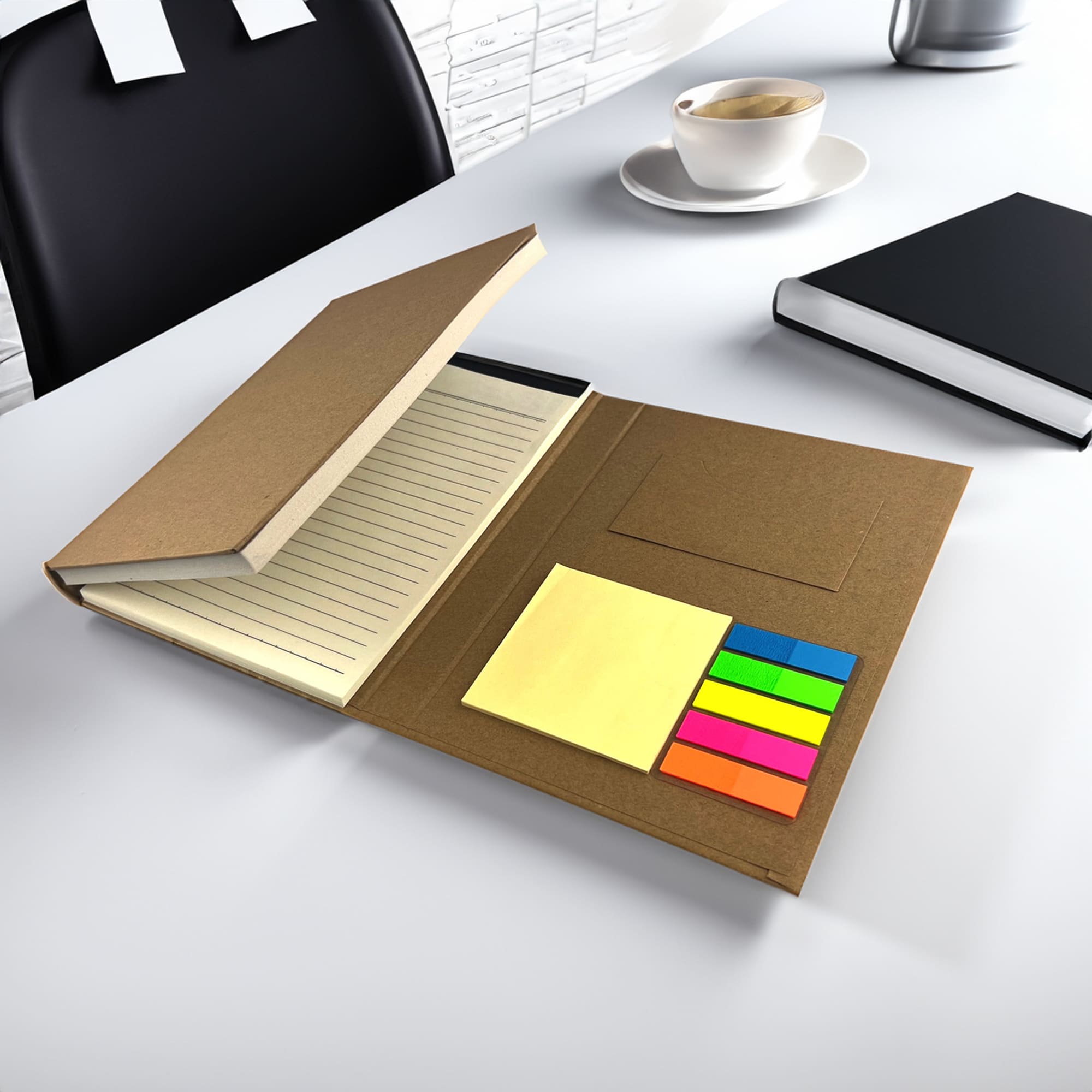 A brown memo stationery set featuring a lined notebook and colourful sticky notes, displayed on a desk with a chair and cup. Calbe Memo Stationery Set - Image 1