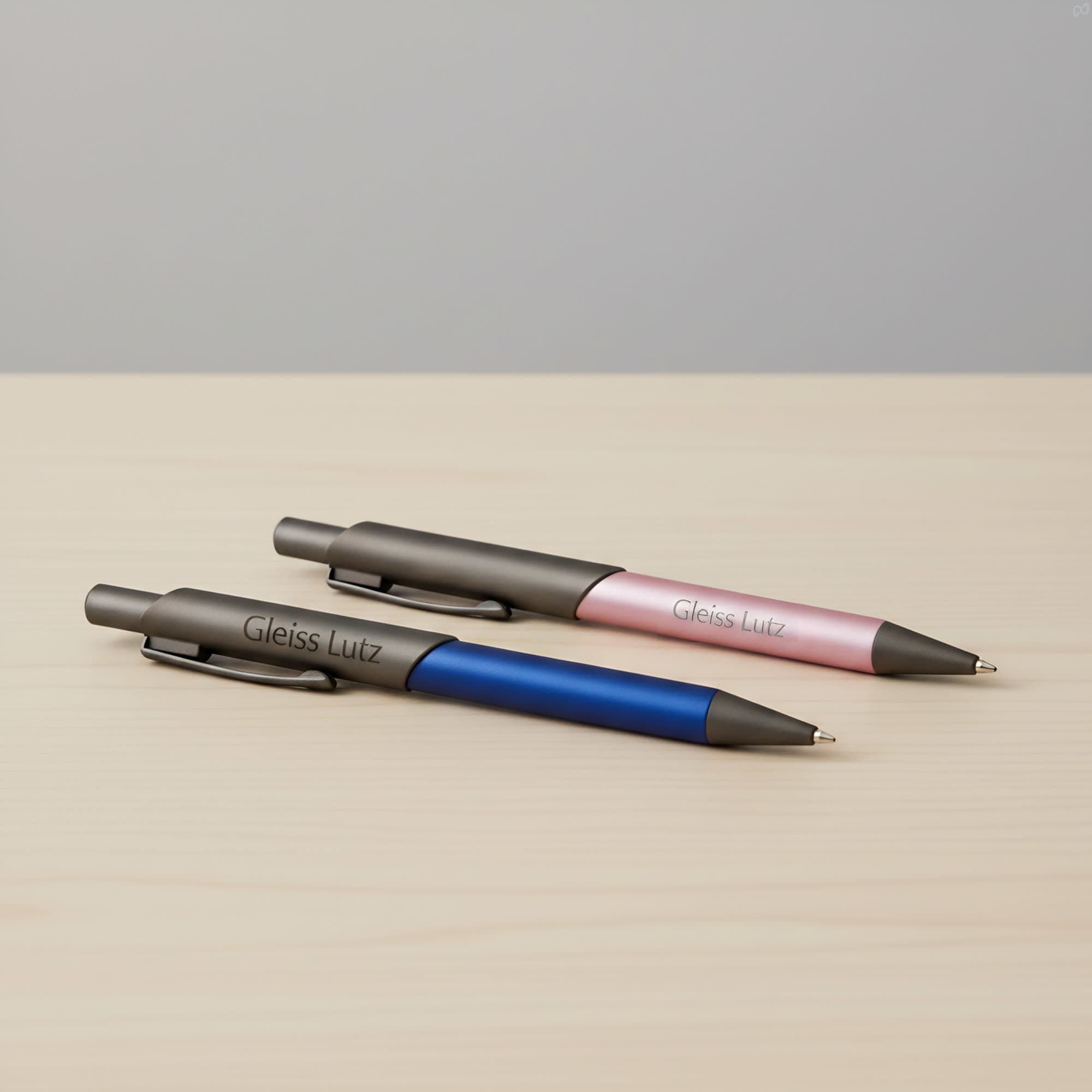 A metal pen set featuring a blue and a pink pen, both with a sleek design and branding on the barrel. Arc Metal Pen - Image 1