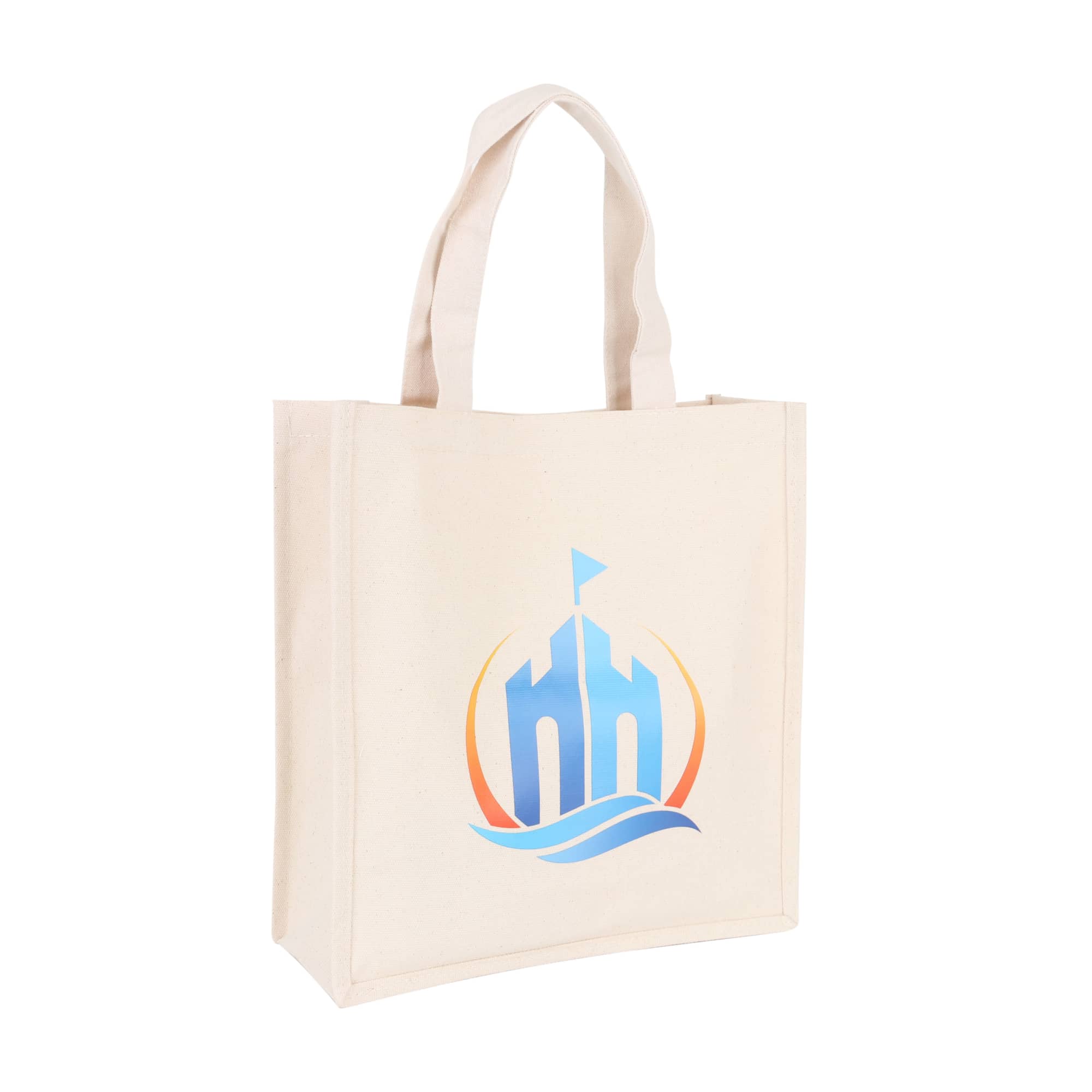 A cream-coloured cotton tote bag with a logo featuring a stylised building and wave design. 340gsm Cotton Tote Bag - Image 1