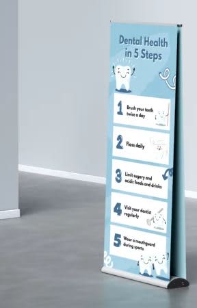 A double-sided pull-up banner, 850mm x 2000mm, featuring a blue design and dental health tips. It includes a logo. Double Sided Premium Pull Up Banner 850mm x 2000mm - Image 1