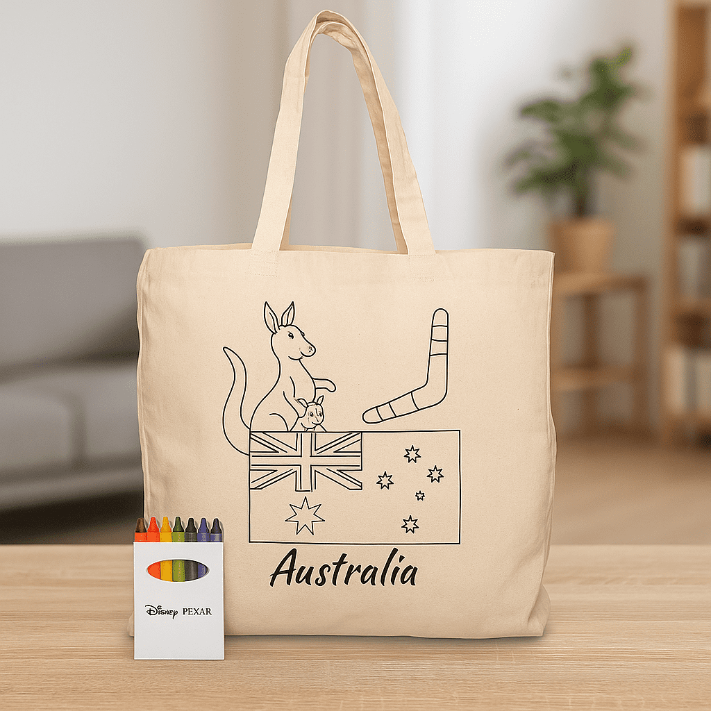 A beige tote bag featuring an illustration of a kangaroo and Australian symbols, accompanied by a crayon set. Squiggle Calico bag + Crayon set - Image 1