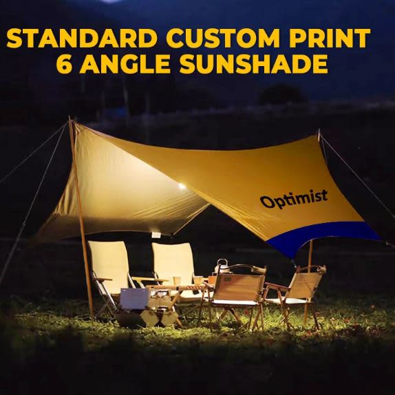 A yellow camping canopy with six angles set up outdoors, accompanied by chairs and a table. It has a logo. Camping Canopy 6 Angel + Poles - Image 1