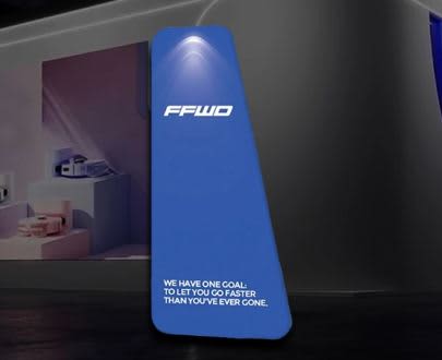 A blue, triangular tension fabric display with a light at the top and a logo. The display has a sleek design. Stretch Fabric Display / Tension Fabric Display -Triangular Frame - Image 1