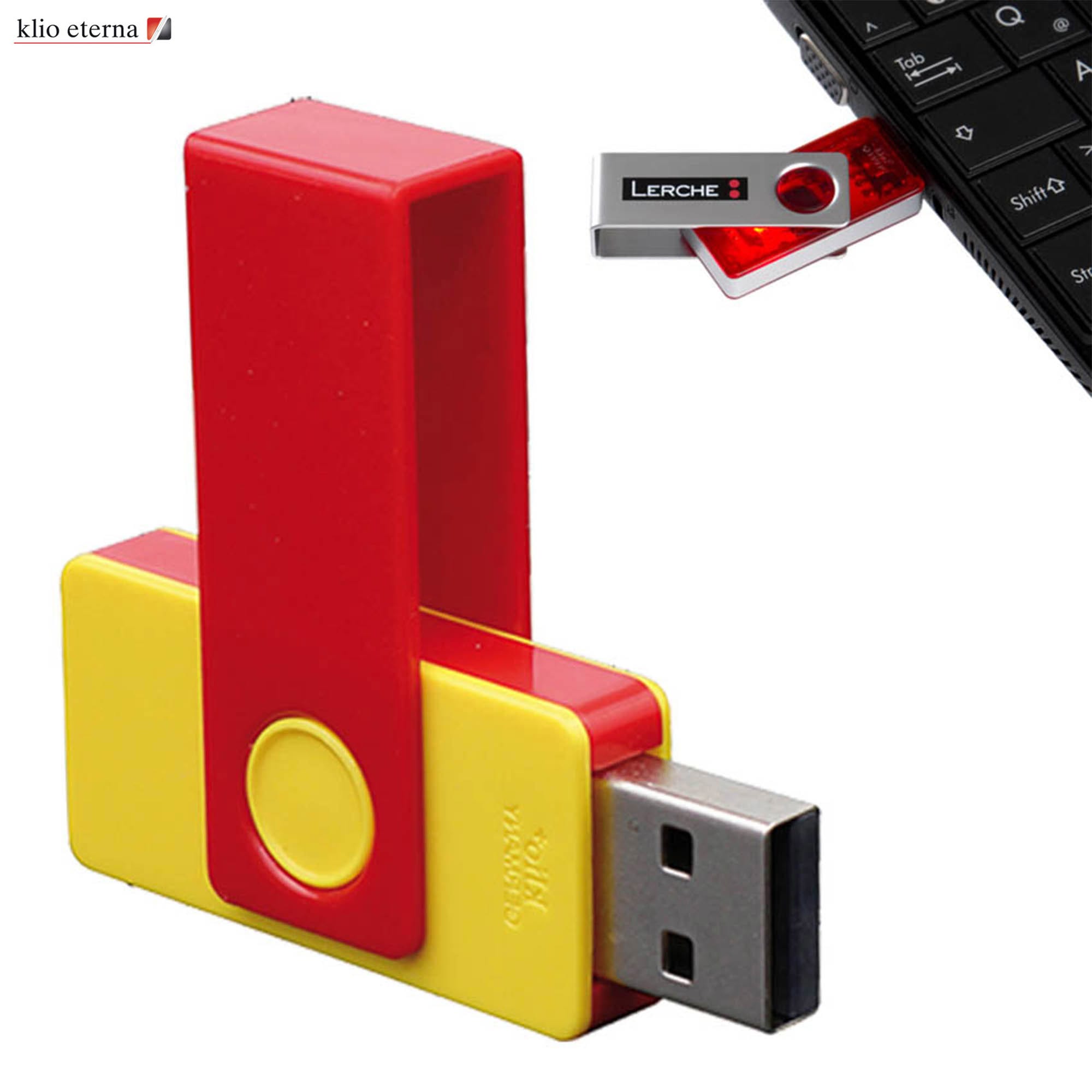 A red and yellow USB flash drive with a plastic clip, 32GB capacity, alongside a smartphone keyboard. USB with Plastic Clip 32GB - Image 1