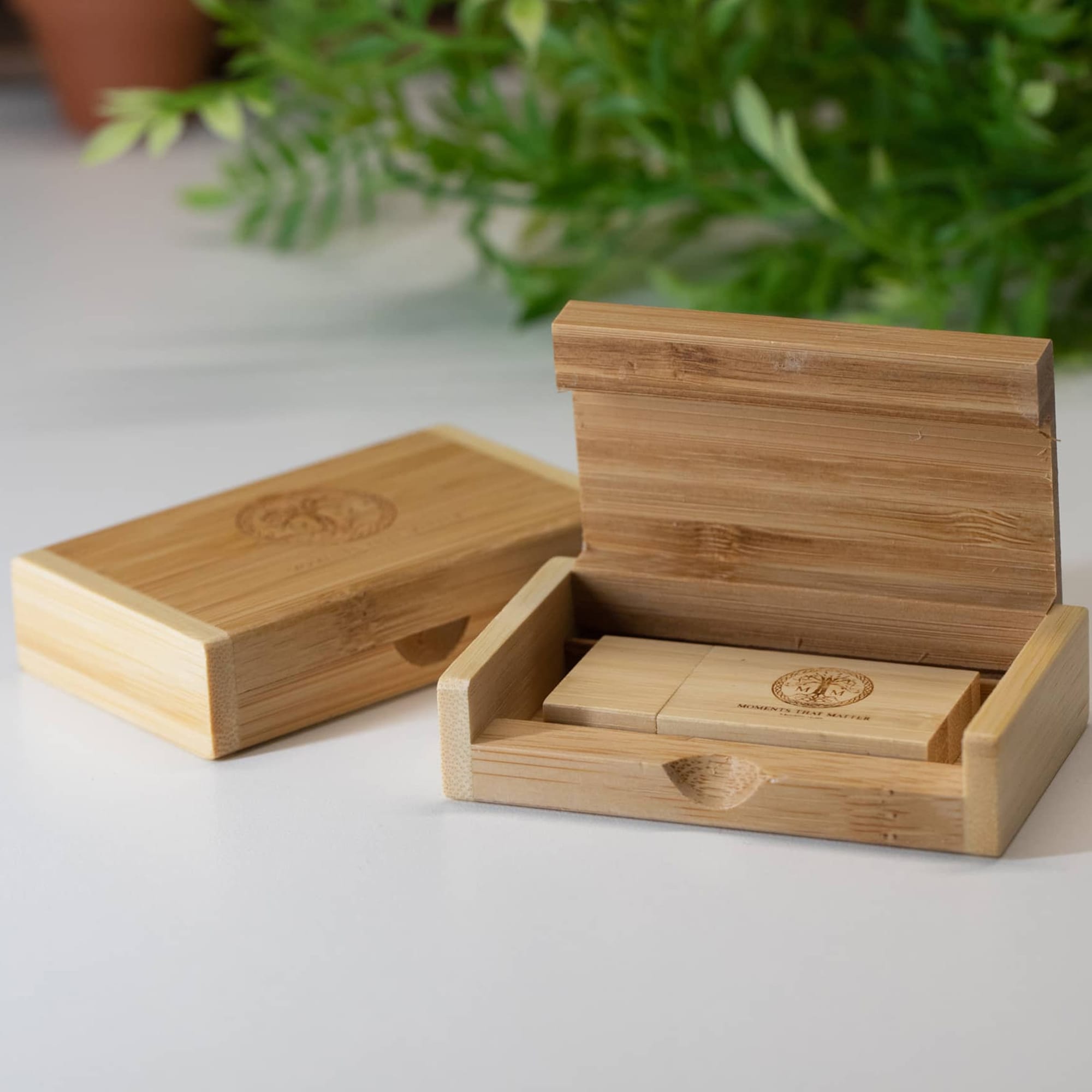 A bamboo phone case displayed in an open and closed position, featuring a simple design and natural wood finish. Accelty Bamboo Case - Image 1