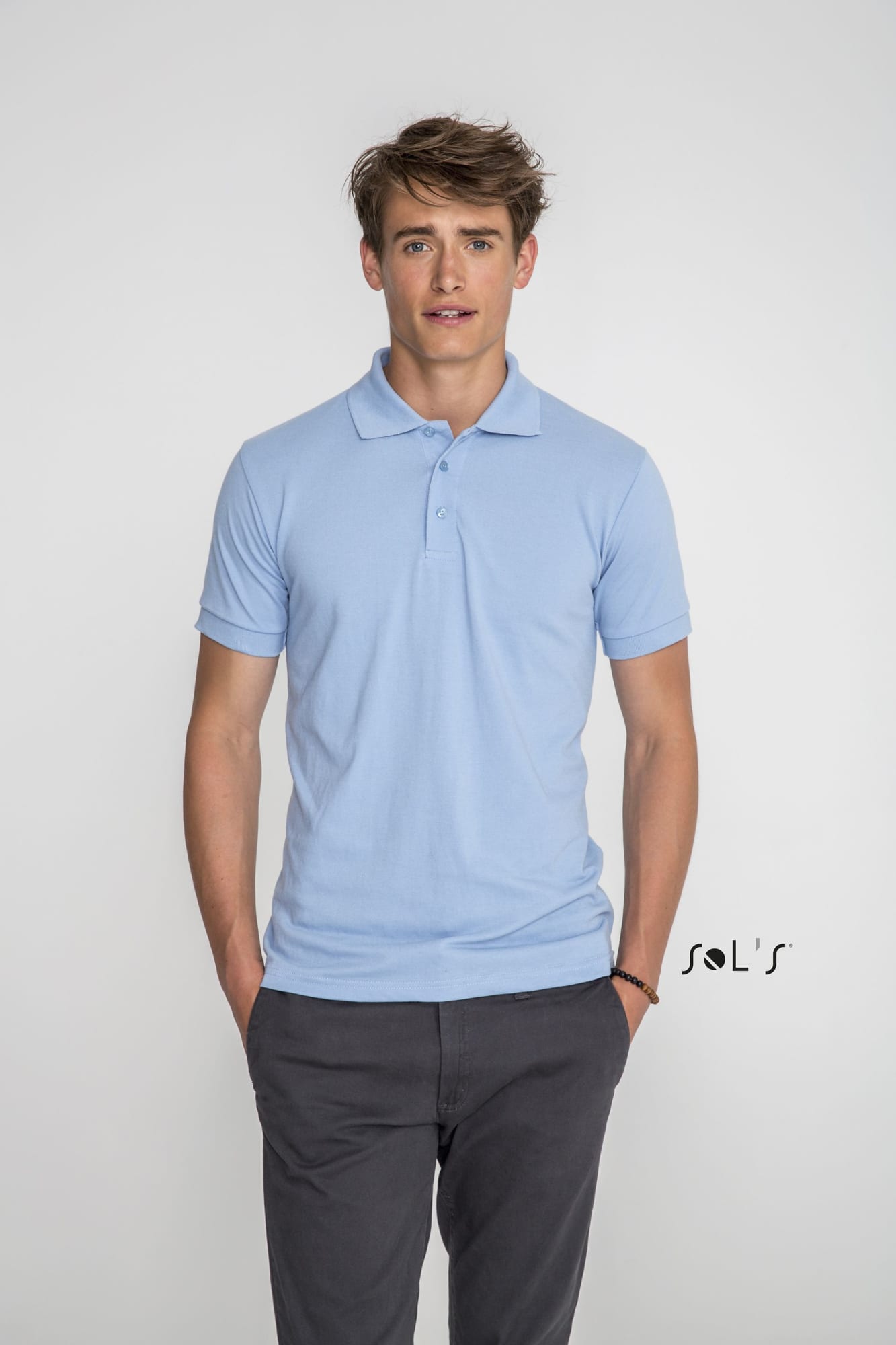 A light blue men's polo shirt made of 65% polyester and 35% ring spun cotton. The shirt features a logo. Polo shirt Men's 65% polyester 35% ring spun cotton PRIME - Image 1