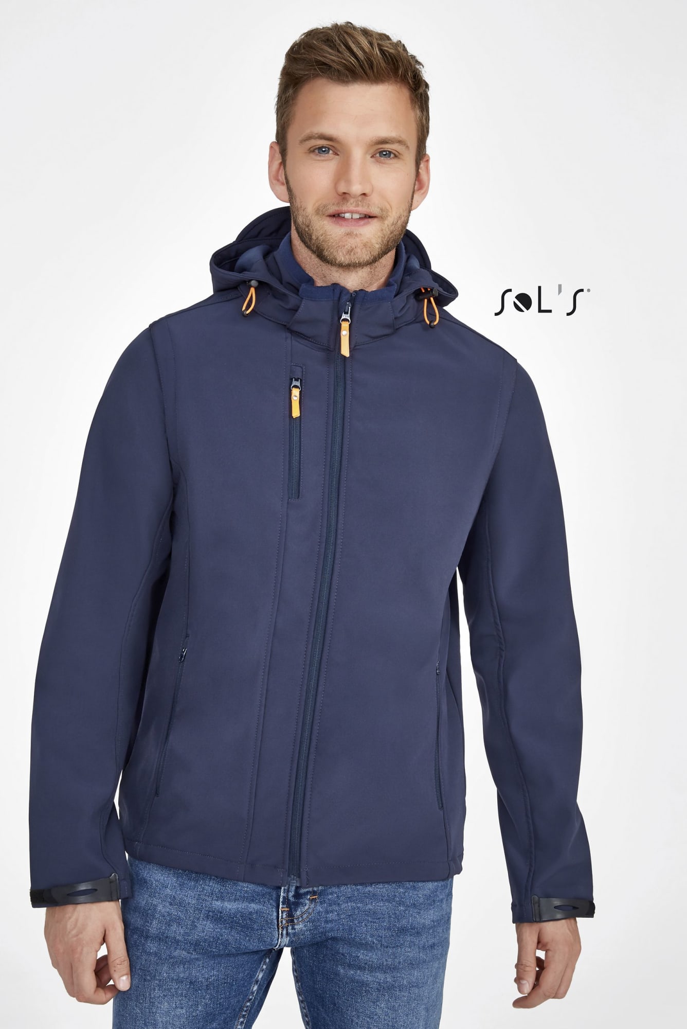 A navy blue unisex soft shell jacket with a removable hood and sleeves, featuring a logo on the chest. Jacket UNISEX softs shell removeable hood and sleeves TRANSFORMER - Image 1
