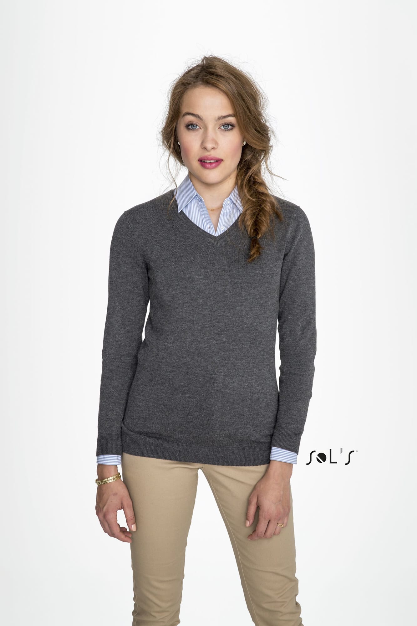 A women's V-neck jumper in charcoal grey, paired with a light blue collared shirt, modelled by a woman. Jumper women's V neck GLORY - Image 1