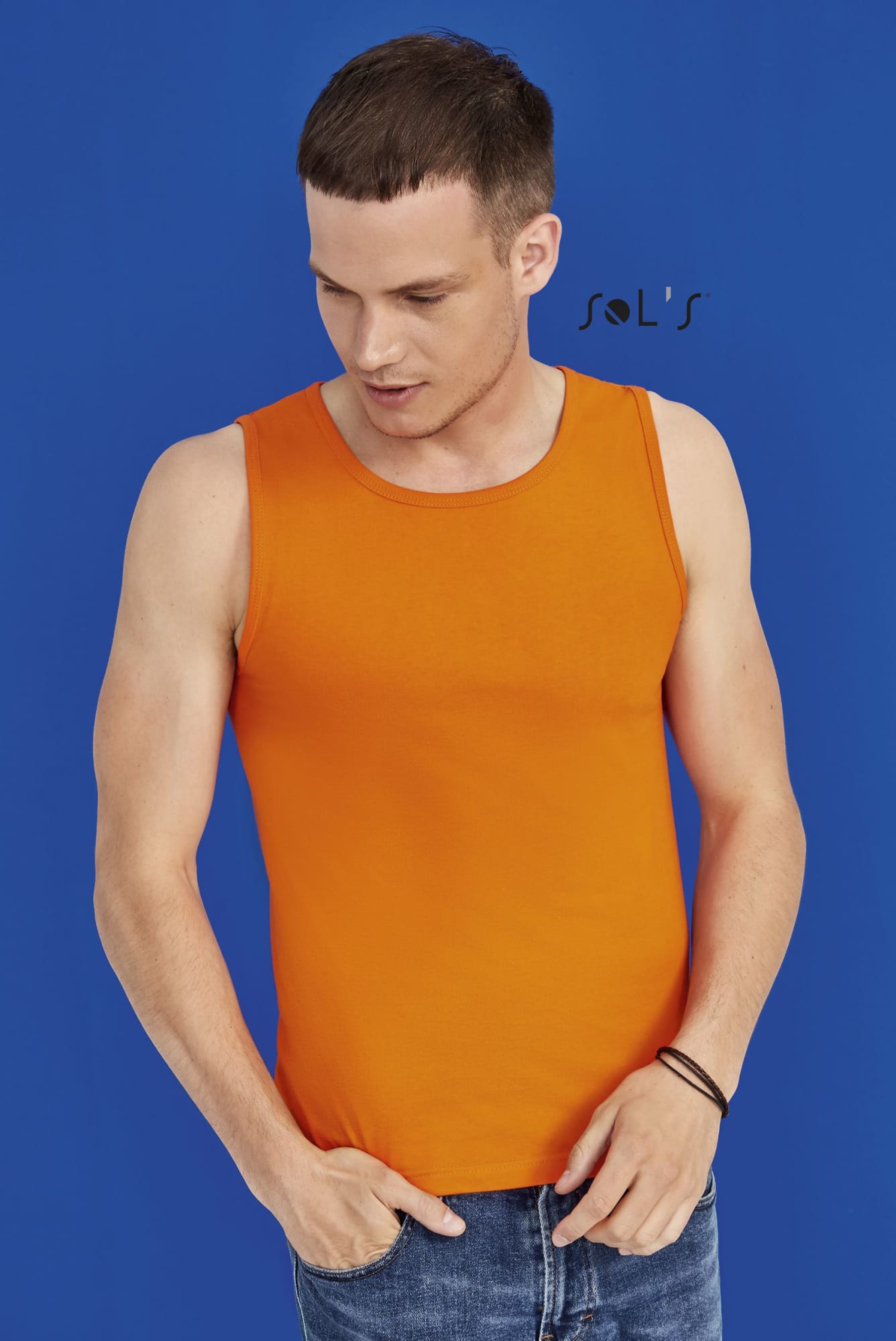 An orange men's tank top is displayed on a model against a blue background. The top has a logo. Singlet / Tank top men's JUSTIN - Image 1