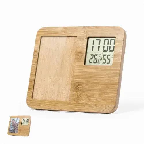 A wooden desk clock with a digital display showing time and temperature. The clock features a rectangular shape and a natural finish. Krent - Image 1