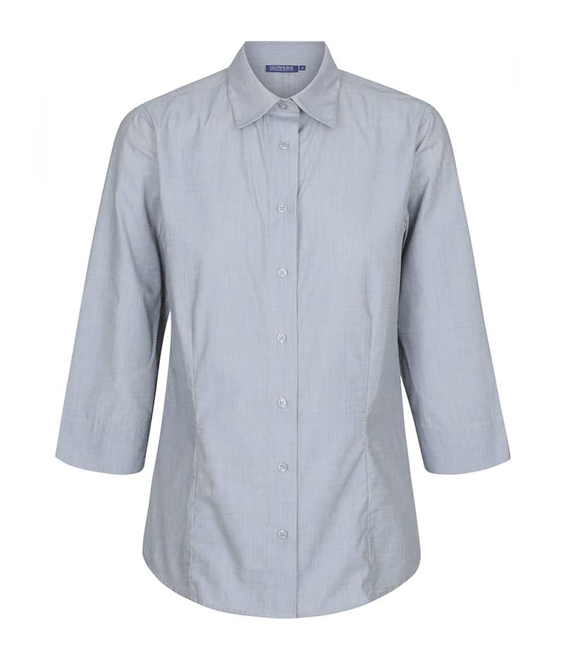A light blue button-up shirt with three-quarter sleeves and a collar. It features a front button closure and has a branded logo. Smith - Image 1