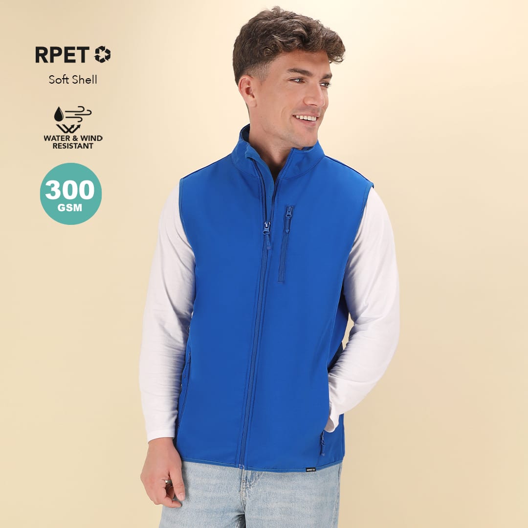 A blue soft shell vest with a zip front and side pockets, featuring a logo on the chest. Jandro Vest - Image 1
