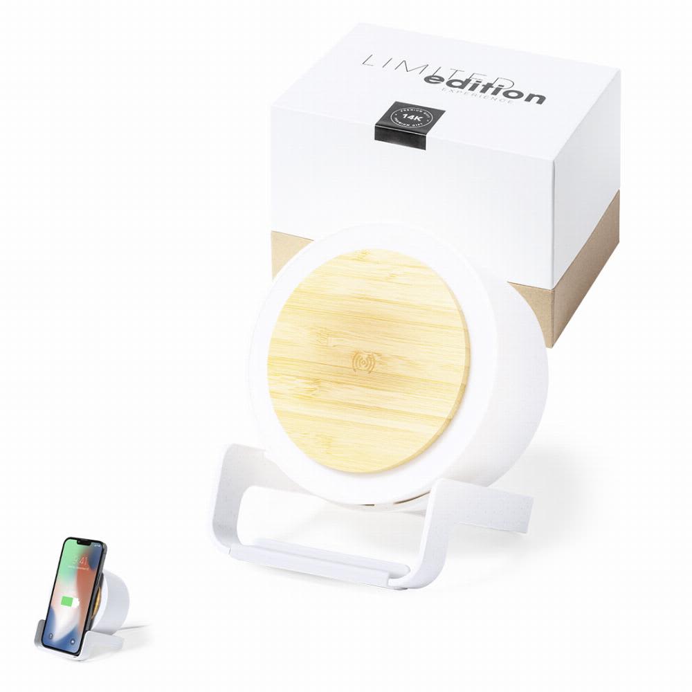A wireless charger with a bamboo top and white base, accompanied by its packaging and a smartphone. Sadow - Image 1