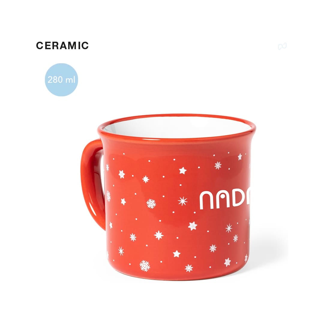 A red ceramic mug featuring a white interior and decorative star patterns, holding 280 ml. Verdux Mug - Image 1