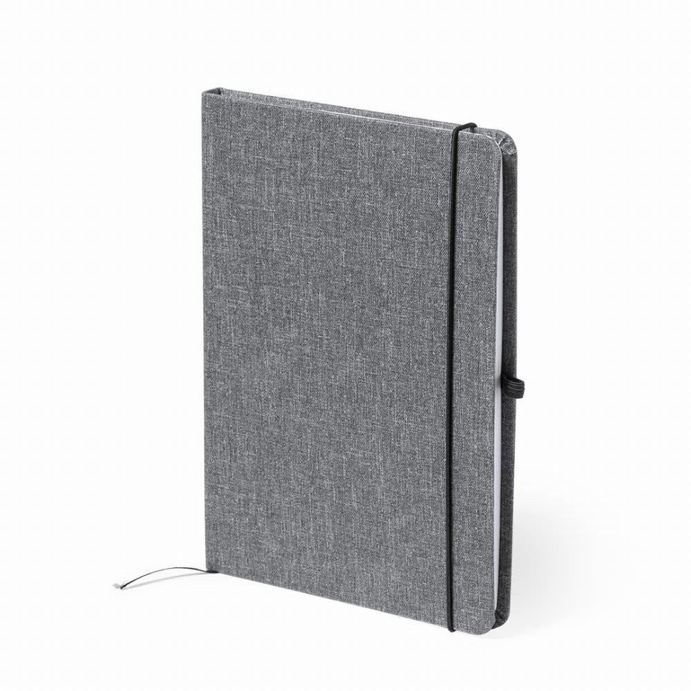 A notebook in grey fabric with a black elastic closure and a ribbon bookmark. It has a plain, minimalistic design. Pacmel - Image 1