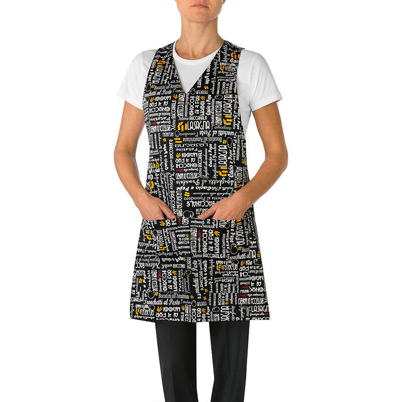 A black apron with various text patterns in white, yellow, and red, featuring pockets and worn by a model. London Apron/Pinafore - Image 1