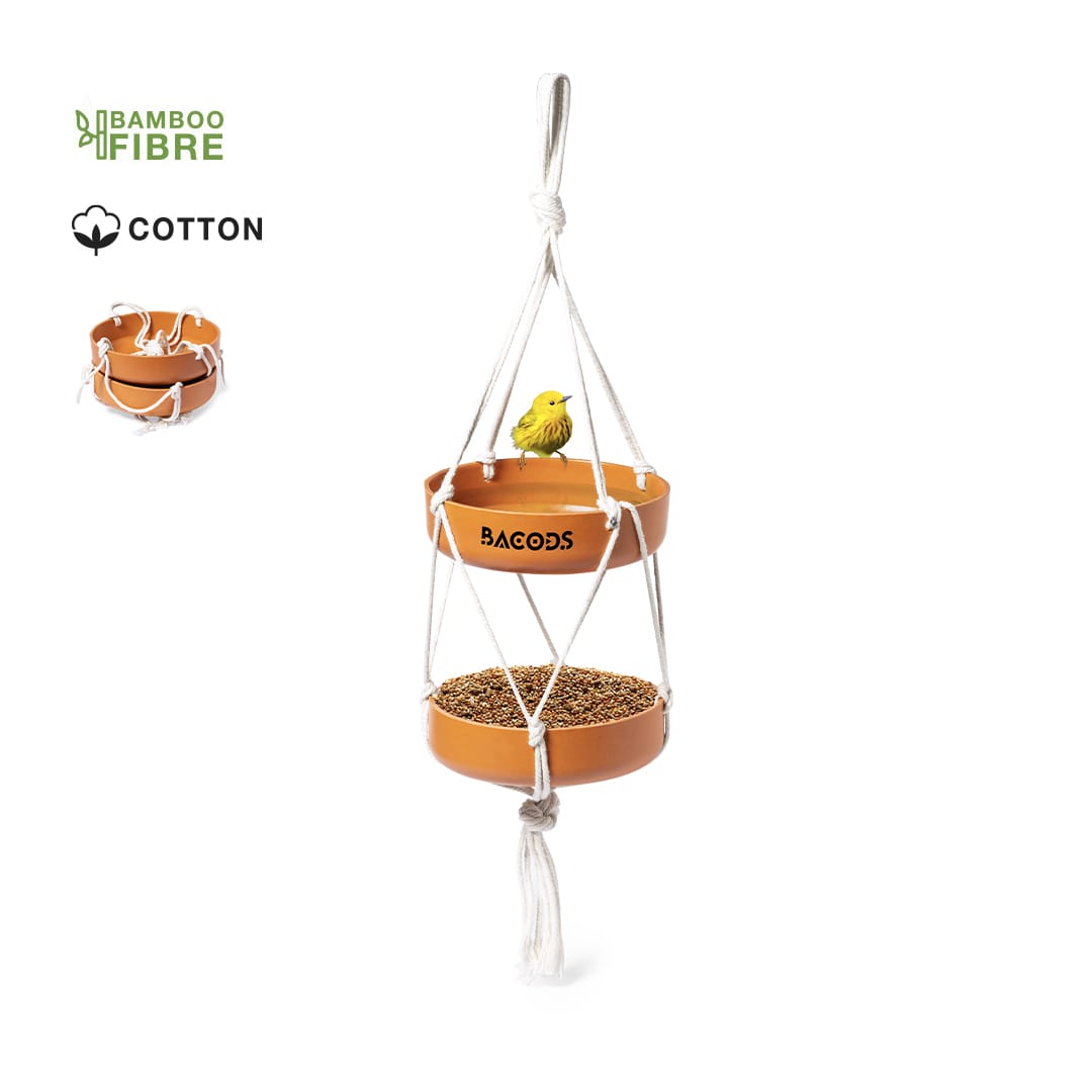 A two-tiered orange bird feeder made of bamboo fibre with a small yellow bird perched on top. Includes cotton rope for hanging. Xilam Bird Feeder - Image 1