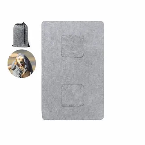 A grey pet mat with two patches, accompanied by a matching storage bag and an image of a dog. Yelyn - Image 1