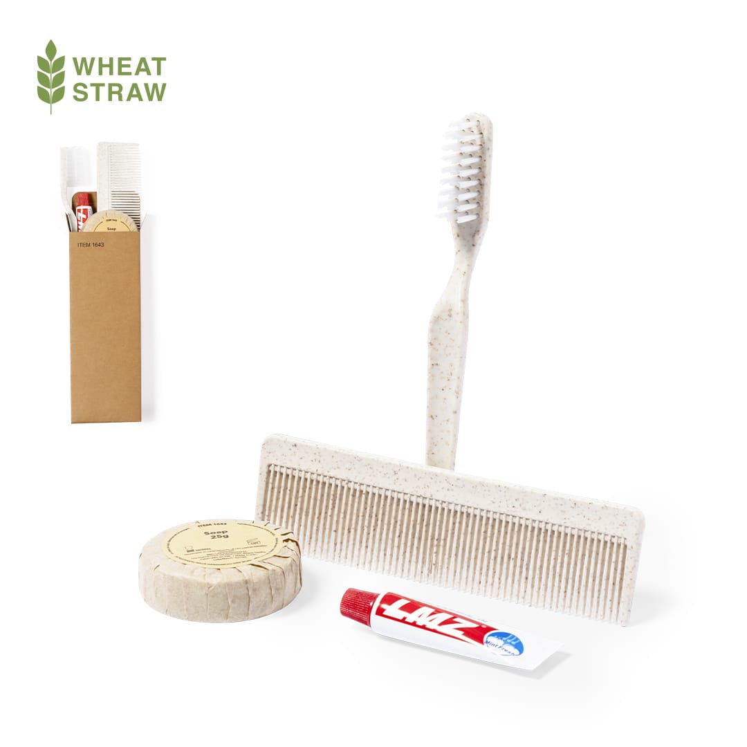 A toiletry bag containing a comb, toothbrush, solid soap, and lip balm, all in natural with a wheat straw theme. Essential Kit Set - Image 1