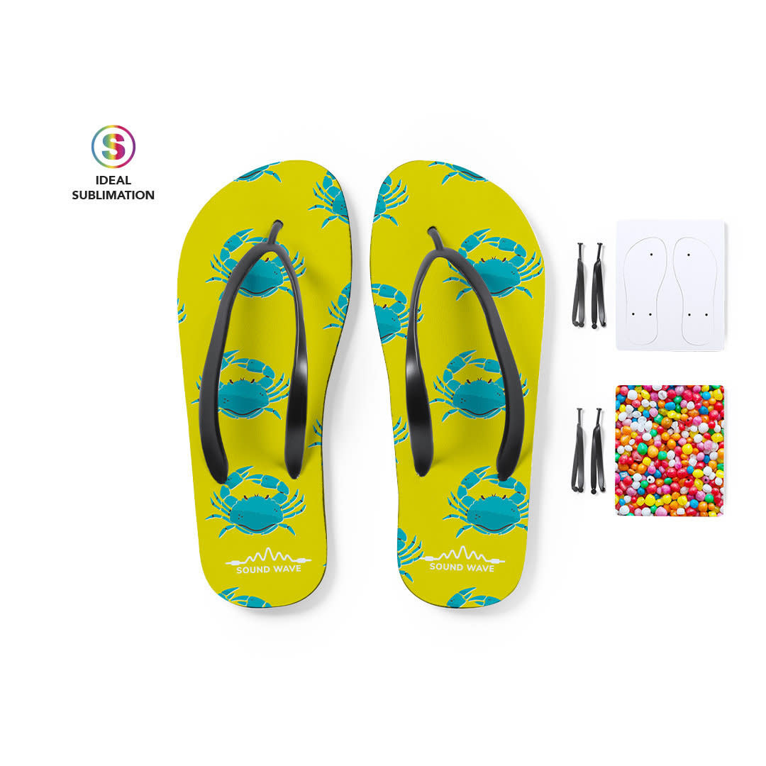 A pair of yellow flip-flops featuring a crab design, with black straps and a set of accessories for customisation. Badrak - Image 1