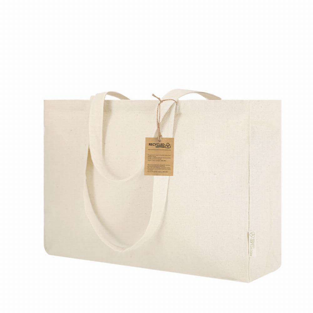 A tote bag in natural cotton, featuring two handles and a tag attached, ideal for carrying items. Framos - Image 1
