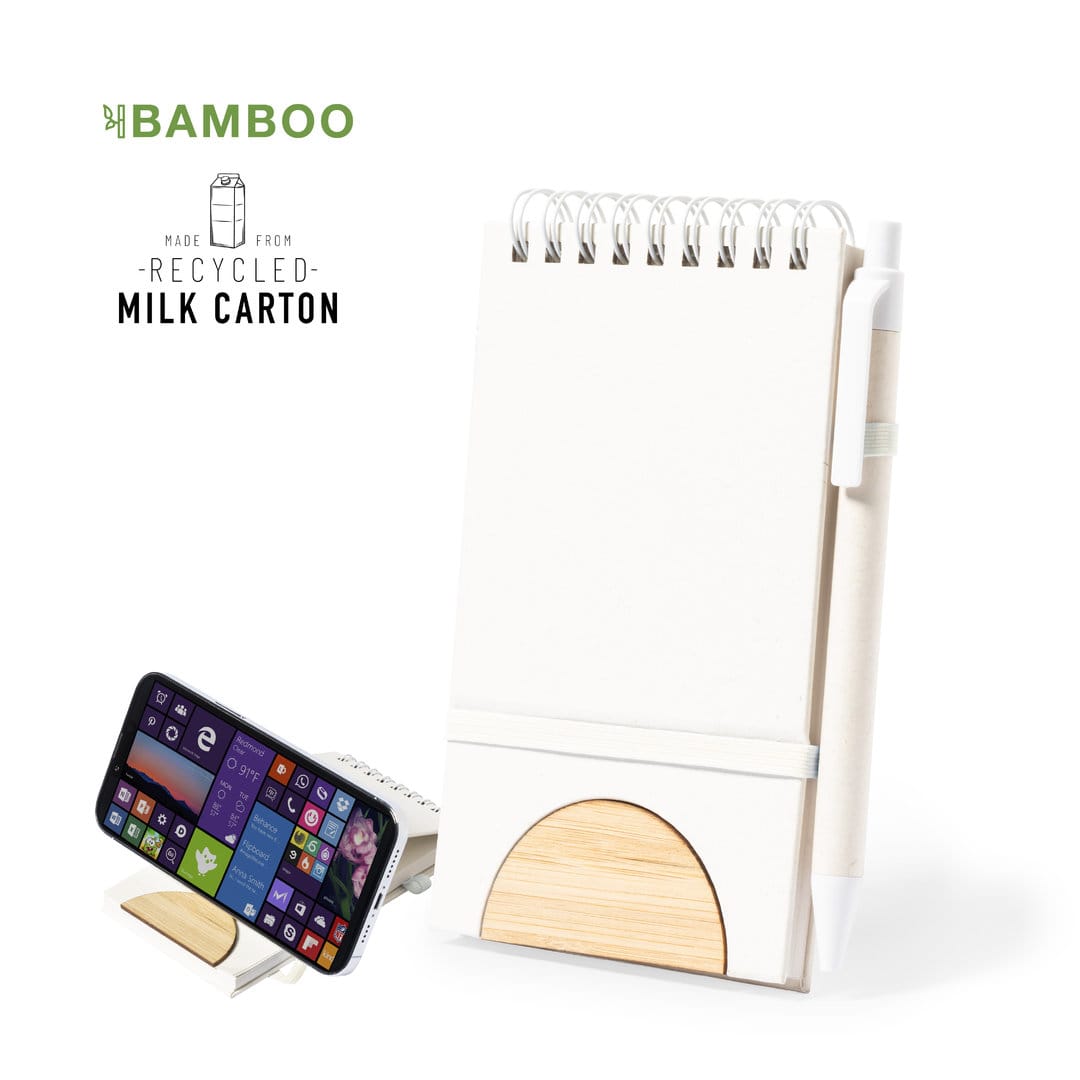 A white notebook with a bamboo holder, accompanied by a pen and a phone stand. It features a logo. Minnak Holder Notebook - Image 1