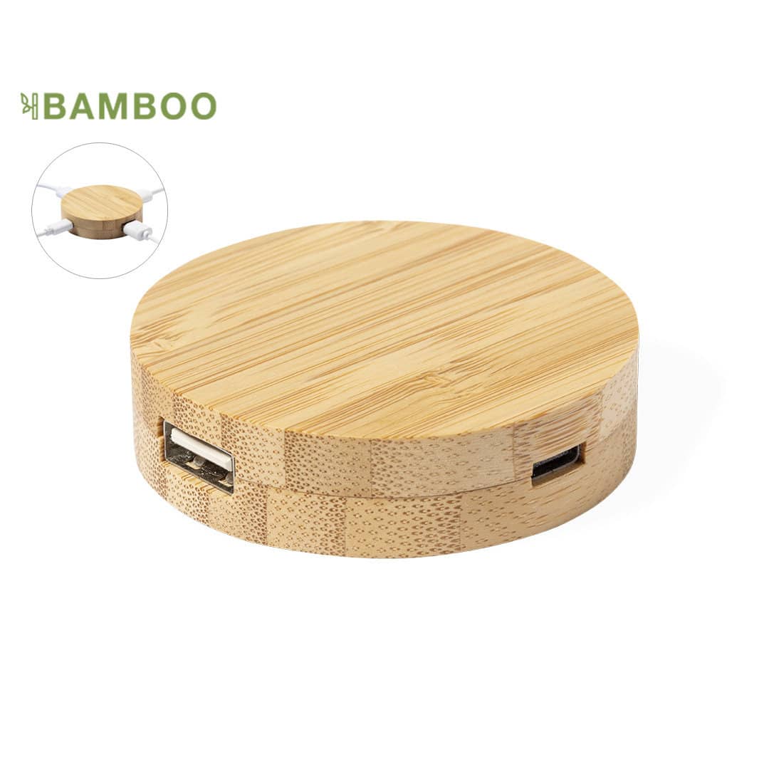 A round bamboo charging station with two USB ports, featuring a natural wood finish and a smooth surface. Lasiar - Image 1