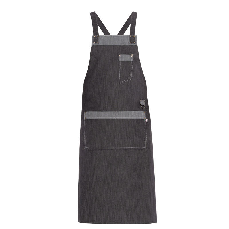 A dark grey apron with adjustable straps and multiple pockets, featuring a logo on the side. Nizza Apron - Image 1