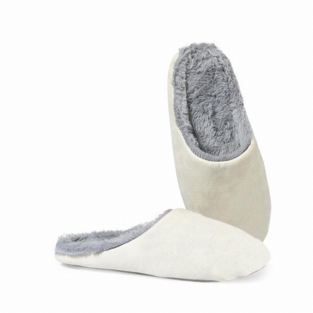 A pair of soft, cream-coloured slippers with grey fuzzy lining, showcasing a comfortable and casual design. Coulter - Image 1