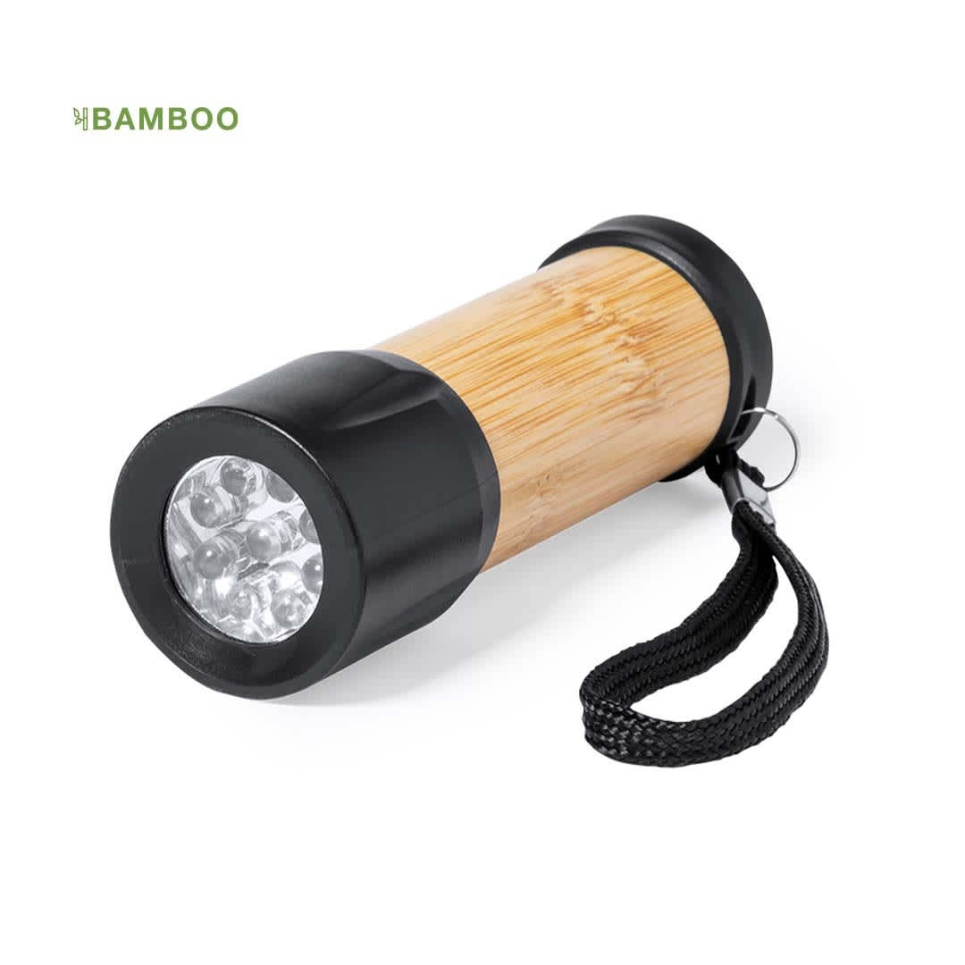 A flashlight featuring a bamboo body and black end caps, equipped with a wrist strap. Freddie - Image 1