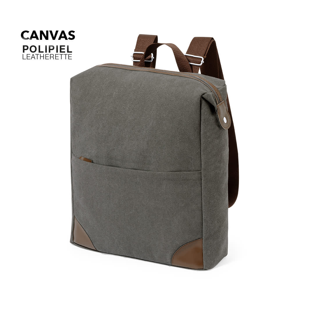 A grey canvas backpack with leatherette accents and adjustable straps, featuring a front pocket and a logo. Grant Backpack - Image 1