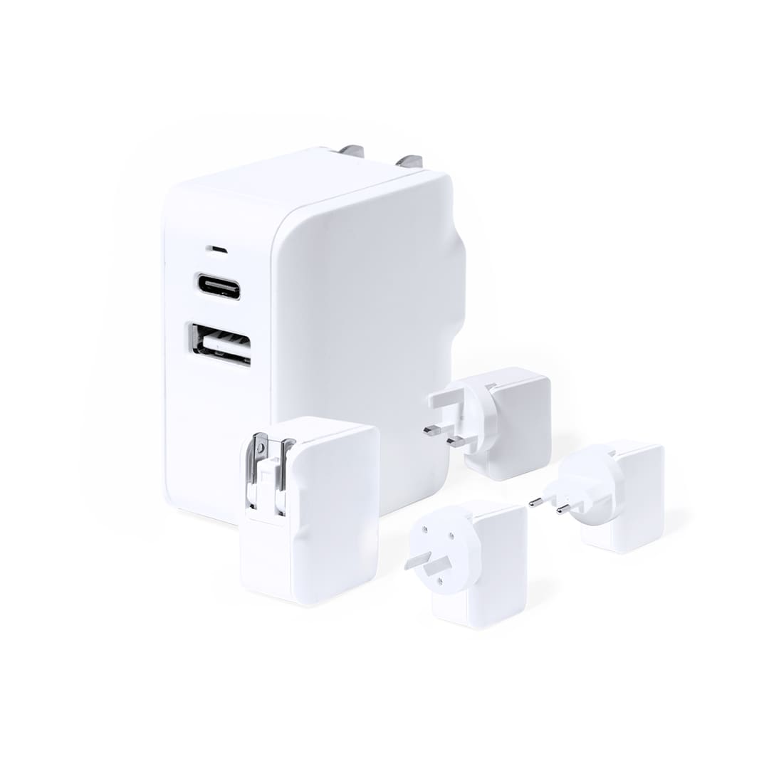 A white travel adapter with a USB-C port, a USB-A port, and four interchangeable plug heads. Vlind Plug Adapter - Image 1