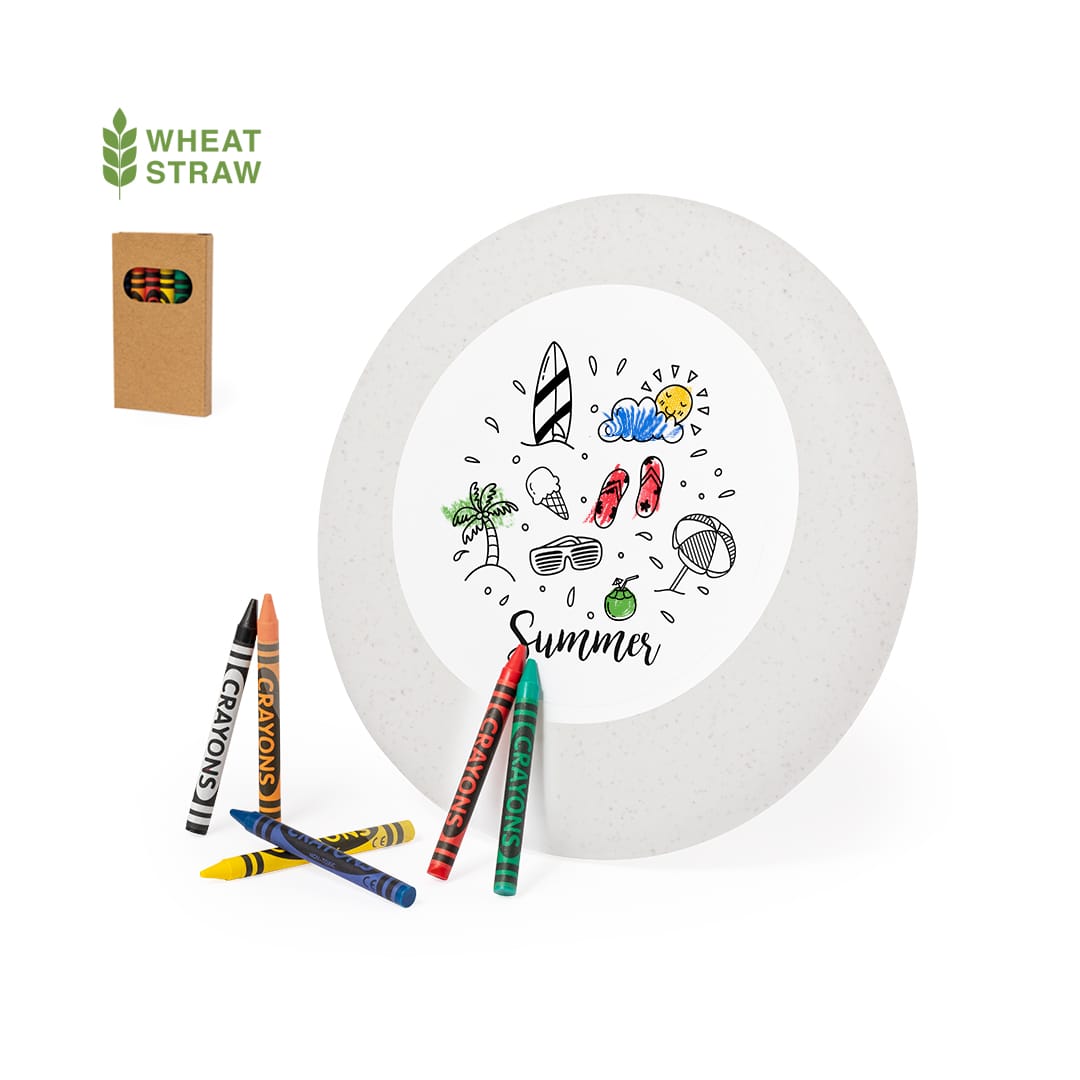 A frisbee made of wheat straw, featuring a summer-themed design, alongside a box of crayons in various colours. Ashen Frisbee - Image 1