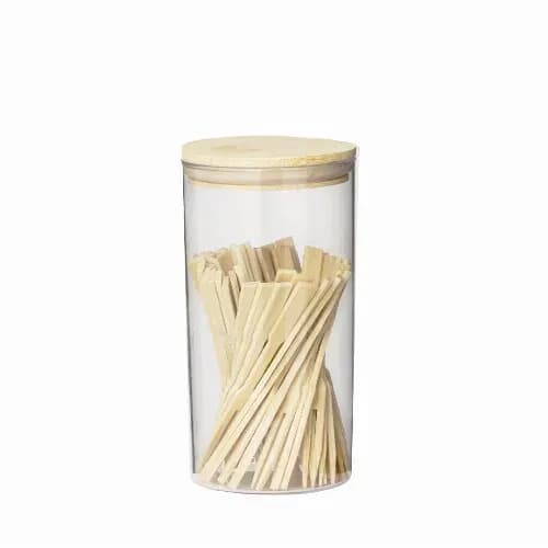 A clear jar containing wooden sticks with a wooden lid. The sticks are arranged inside the jar. Reng - Image 1